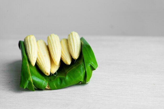 Young corn in a banana leaf. Eco friendly packaging