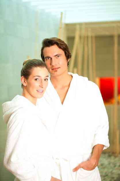 Young couple in bathrobe in Spa