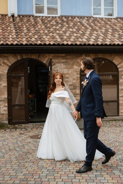 Young couple bride and groom in a white dress