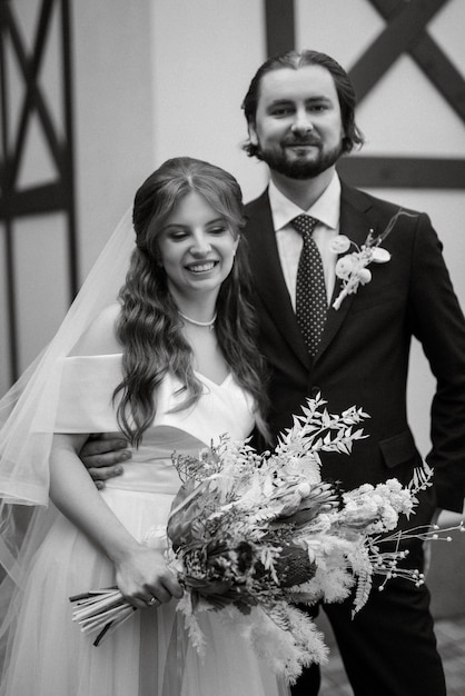 Young couple bride and groom in a white dress