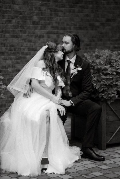 Photo young couple bride and groom in a white dress