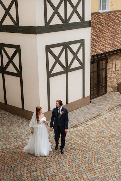 Young couple bride and groom in a white dress