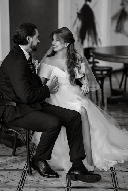 Young couple bride and groom in a white dress