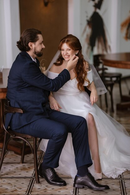 Young couple bride and groom in a white dress