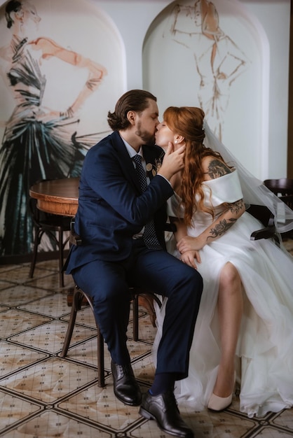 Young couple bride and groom in a white dress