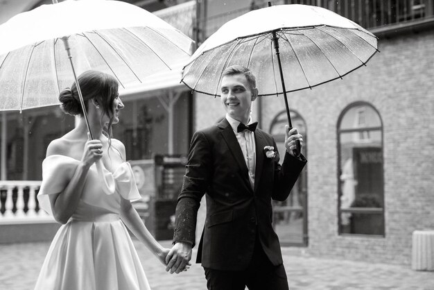 Young couple bride and groom in a white short dress