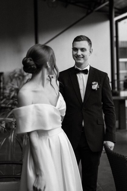 Young couple bride and groom in a white short dress