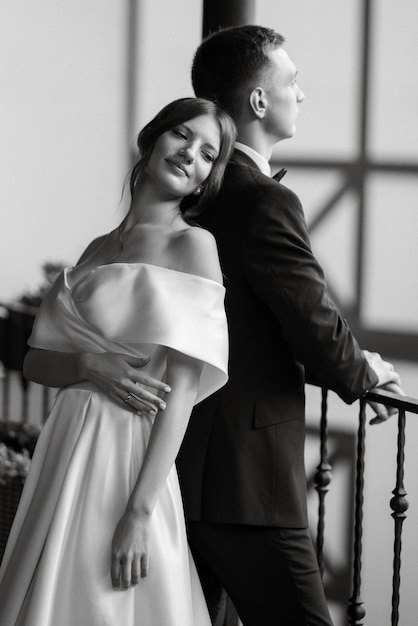 Young couple bride and groom in a white short dress