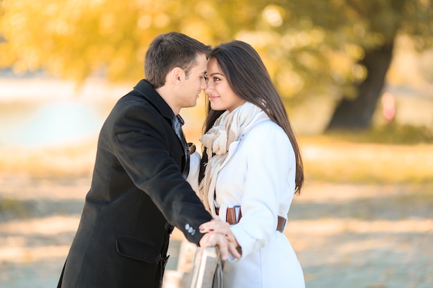 Young couple by the fence