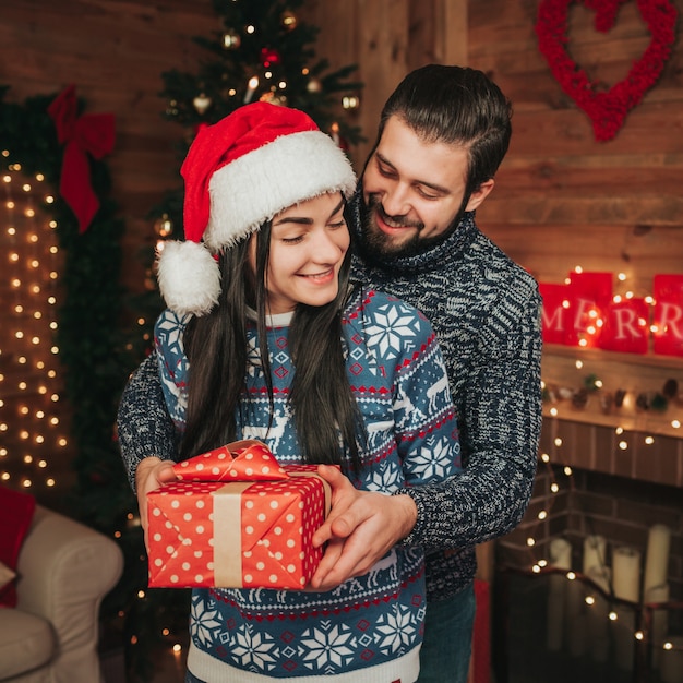 A young couple celebrating the holiday at home