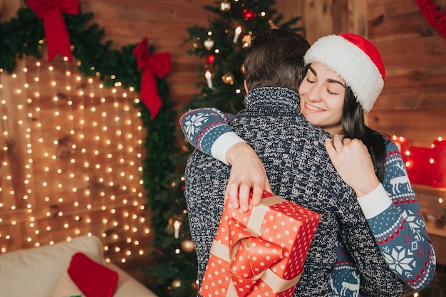 A young couple celebrating the holiday at home