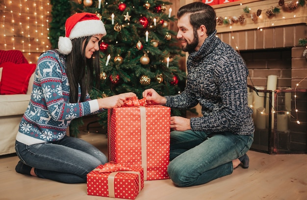 A young couple celebrating the holiday at home