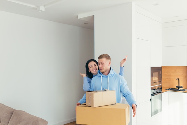 A young couple celebrating a new home