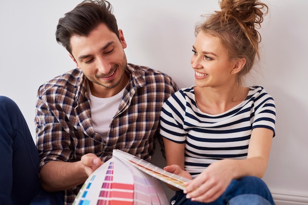 Young couple choosing the perfect color