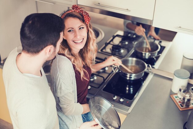 Young couple cooking