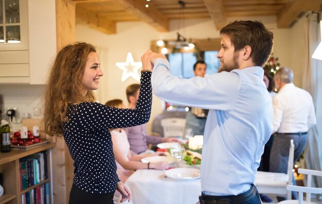 Young couple dancing on a Christmas party