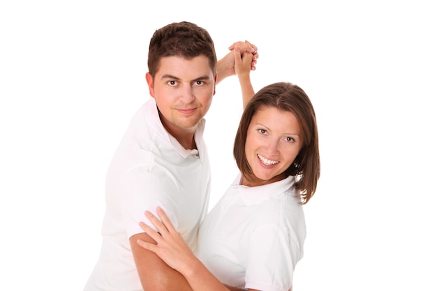 a young couple dancing over white