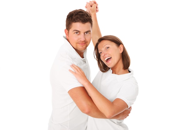 a young couple dancing over white