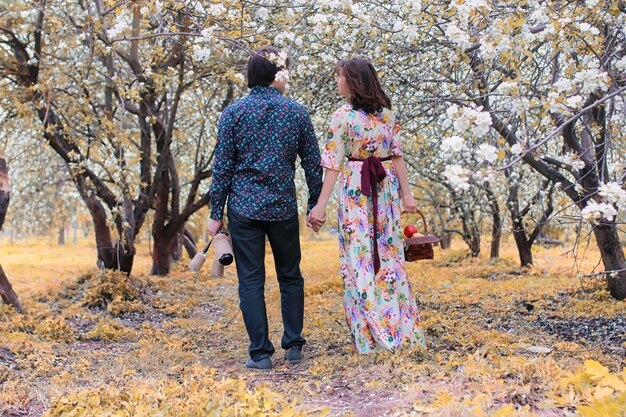 Young couple on date in autumn park outdoor