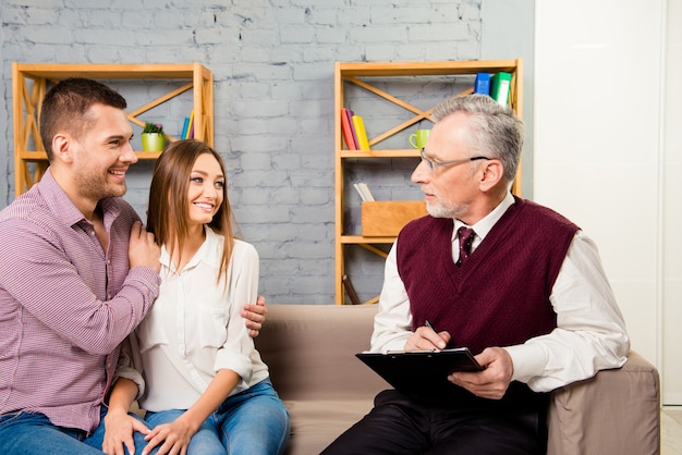 Young couple discussing with a psychologist