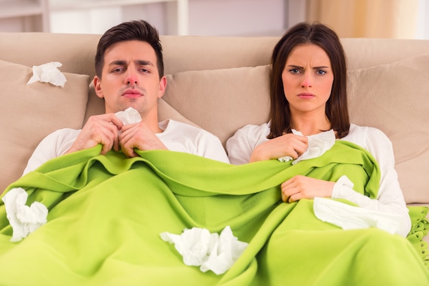 A young couple during disease treatment at home.