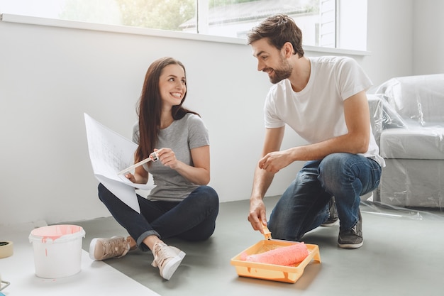 Young couple doing apartment repair together themselves