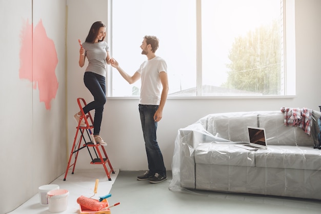 Young couple doing apartment repair together themselves