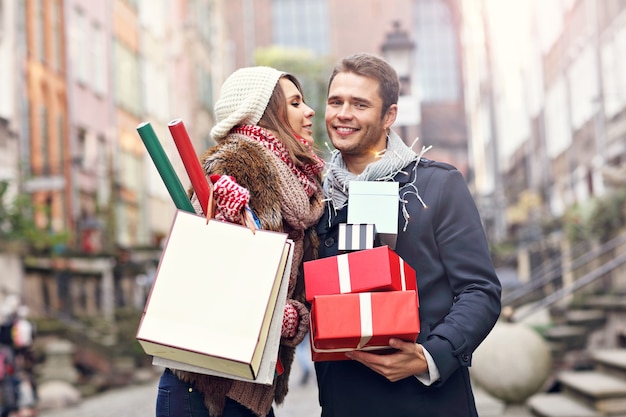 young couple doing Christmas shopping in the city