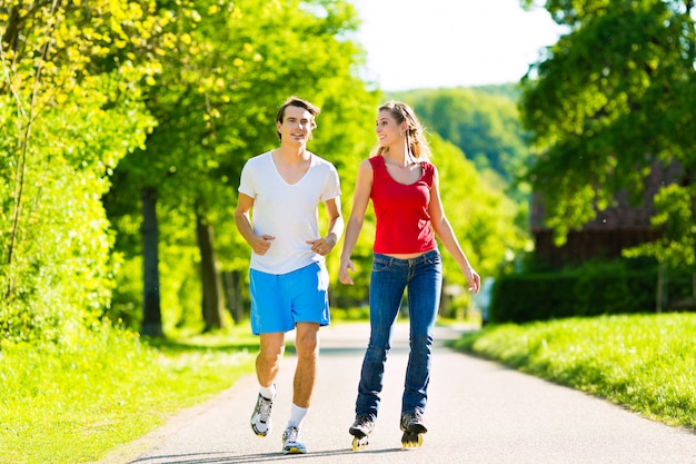 Young couple doing sports outdoors