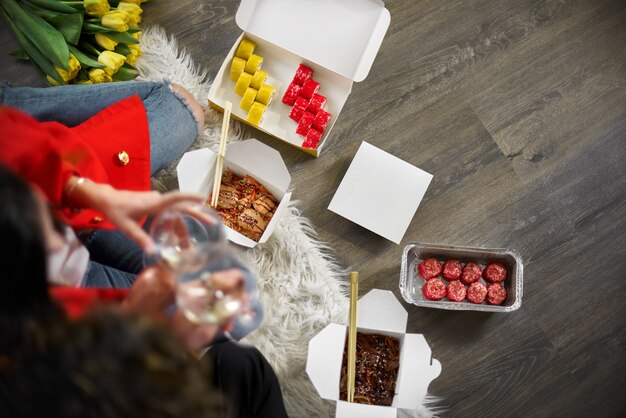  young couple eating sushi. Food delivery concept. Takeaway