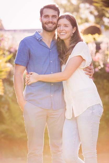 Young couple embracing and standing 