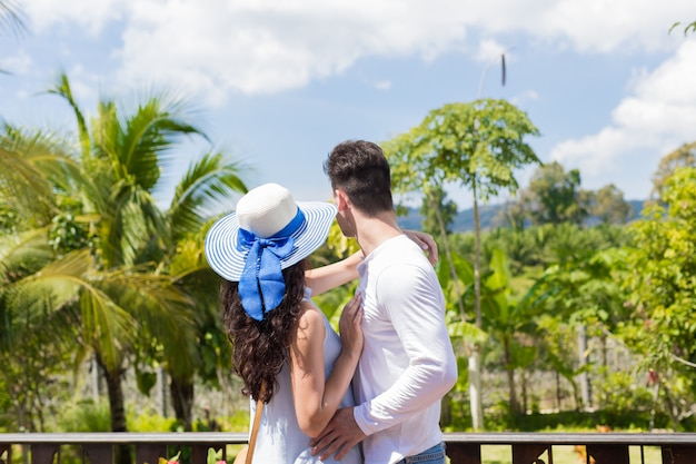 Young Couple Embracing On Summer Terrace Or Balcony 