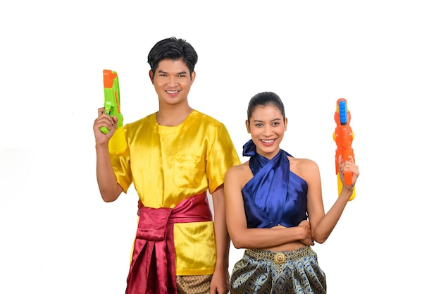 young couple enjoy with water gun on songkran festival