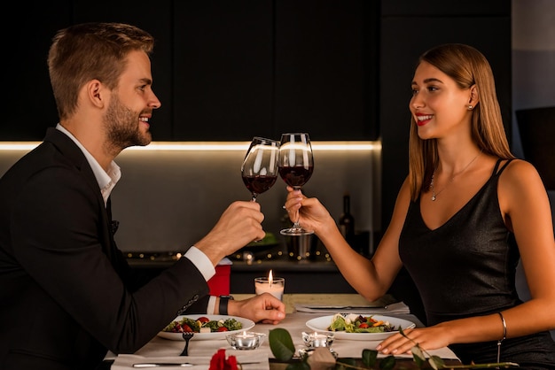 Young couple enjoying romantic dinner together