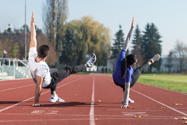 Young Couple Exercising in City Park Area  Training and Exercising for Endurance  Fitness Healthy Lifestyle Concept Outdoor