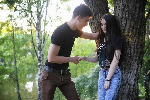 Young couple on the first date in the city park