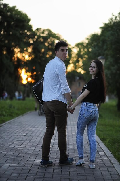 Young couple on the first date in the city park