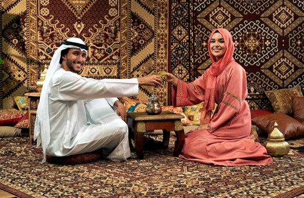 Young couple from Emirati spending time in a cafe