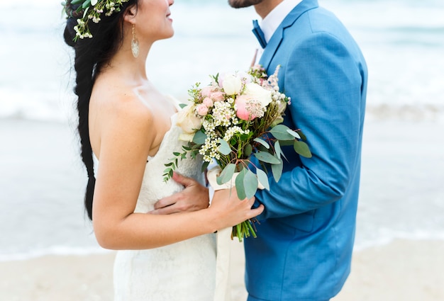 Young couple getting married at the beach