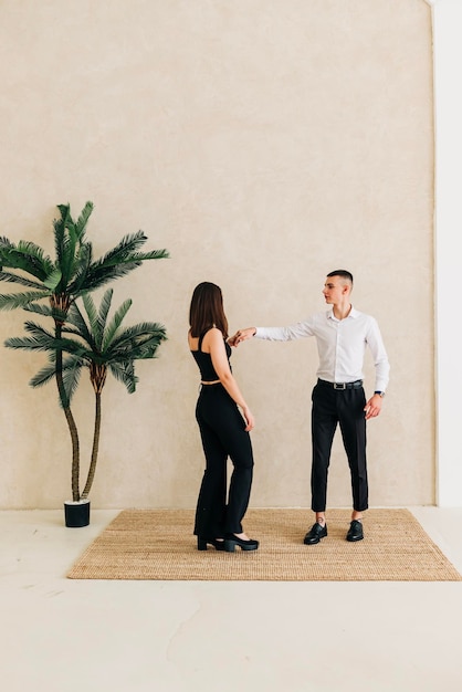 Young couple girl and boy in the studio modern lifestyle portrait Love and relationship