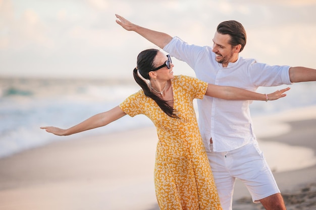 Young couple have fun on the beach