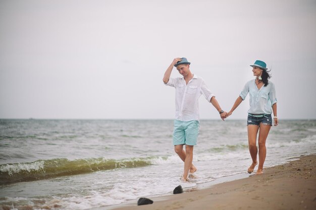 Young couple have fun on summer day at the beach