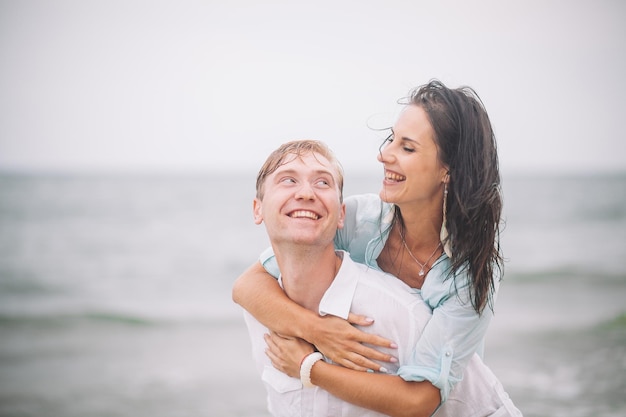 Young couple have fun on summer day at the beach