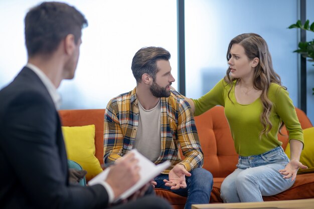 Young couple having an argument during therapy