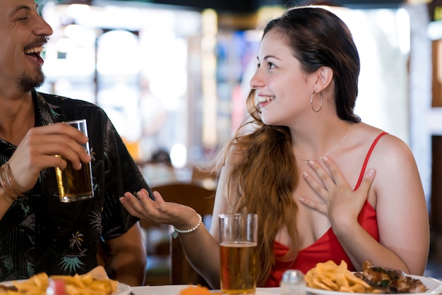 Young couple having lunch together at a restaurant.