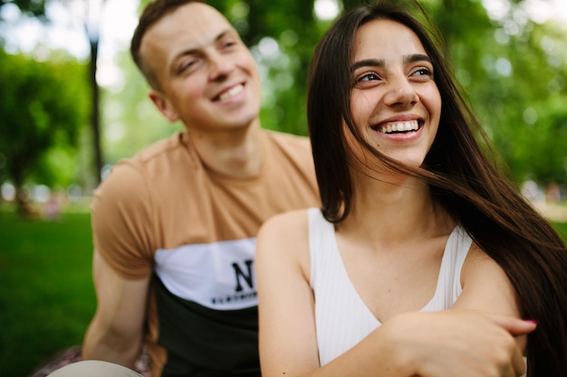 Young couple having picnic in countryside