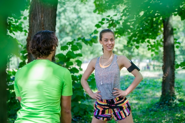 Young couple having training in the park