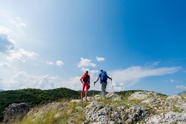 Young couple hiking on the mountain