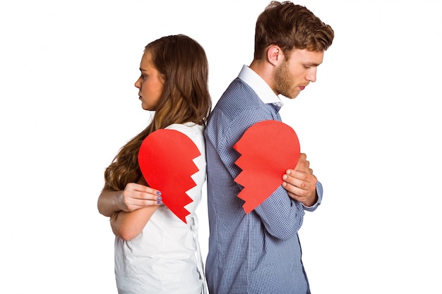Young couple holding broken heart