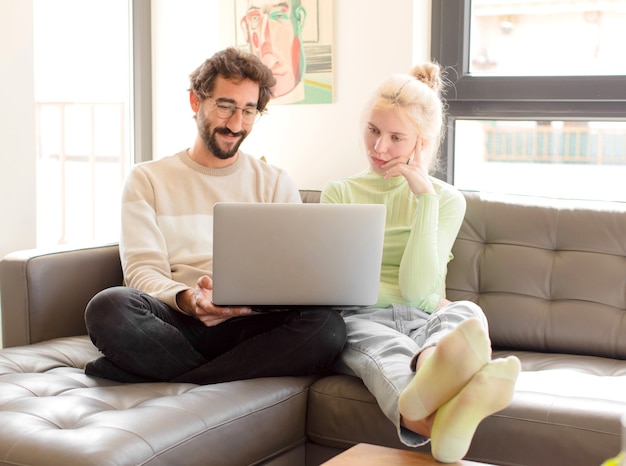 Young couple at home using a laptop